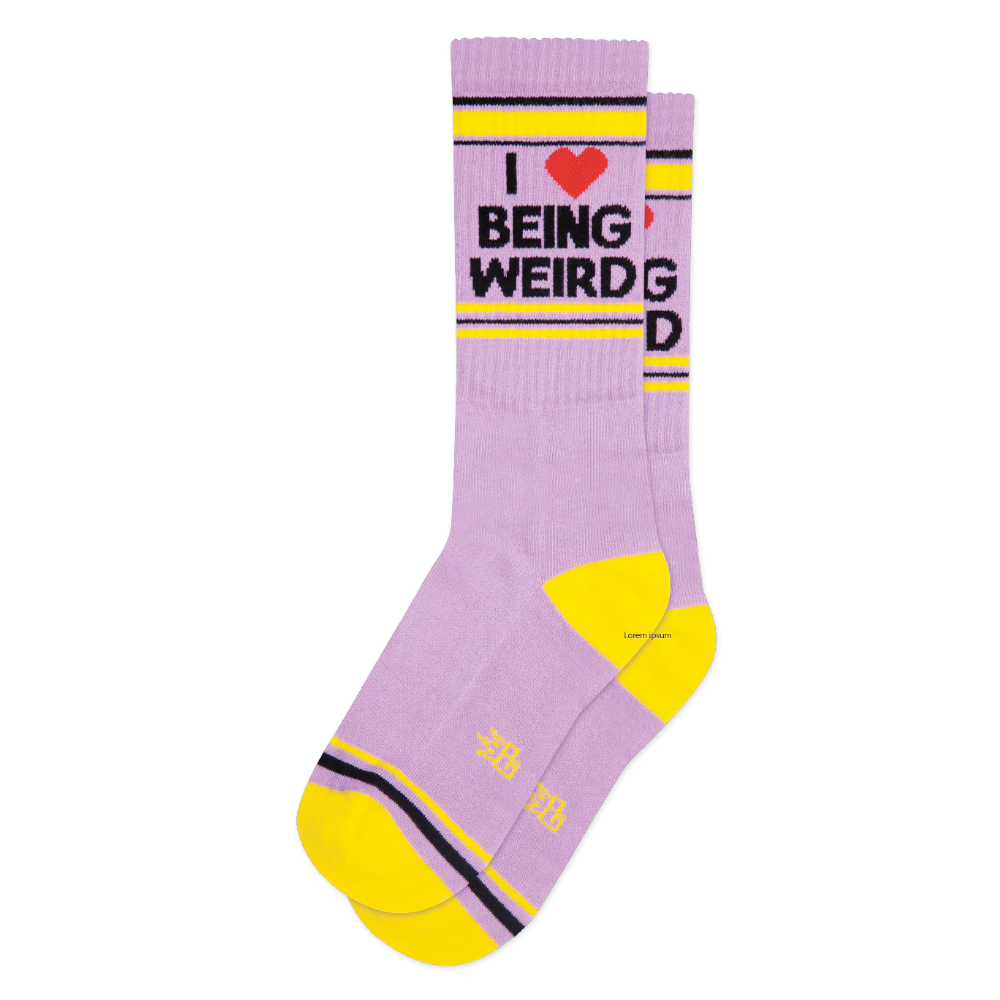 Purple and yellow socks with black text on them