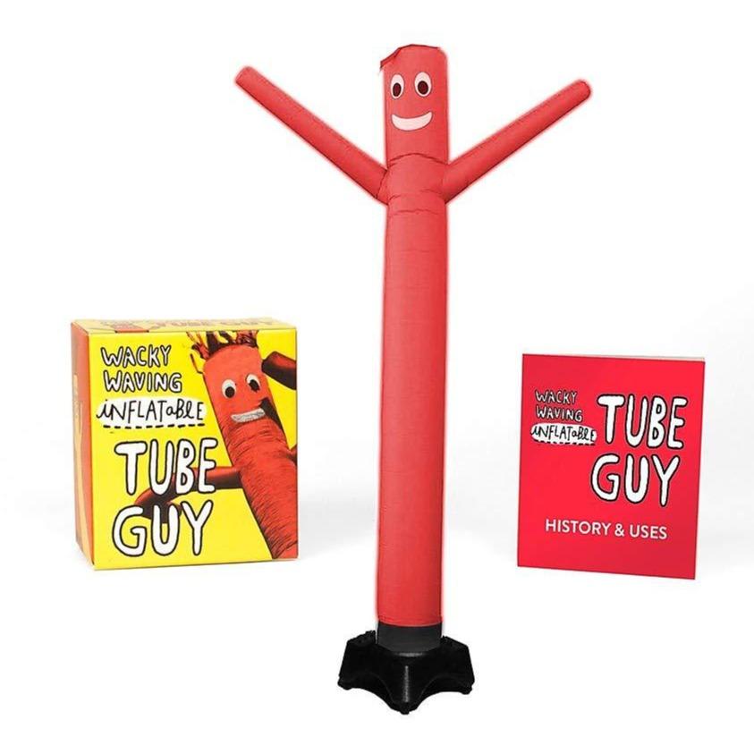 A red inflatable tube man in front of a yellow box and a red booklet