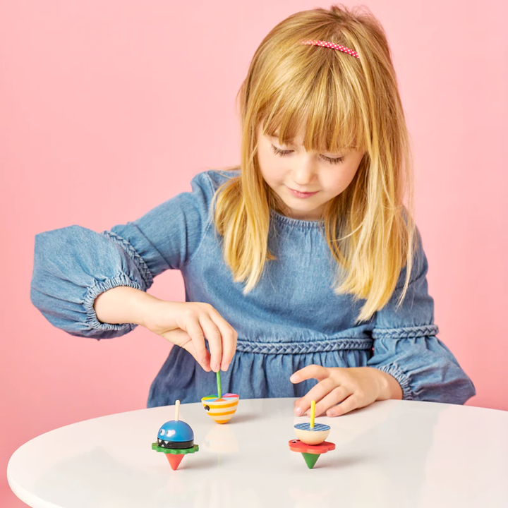 KIKKERLAND Toy Novelties Wooden Dizzy Monster Spinning Top - 1 random style